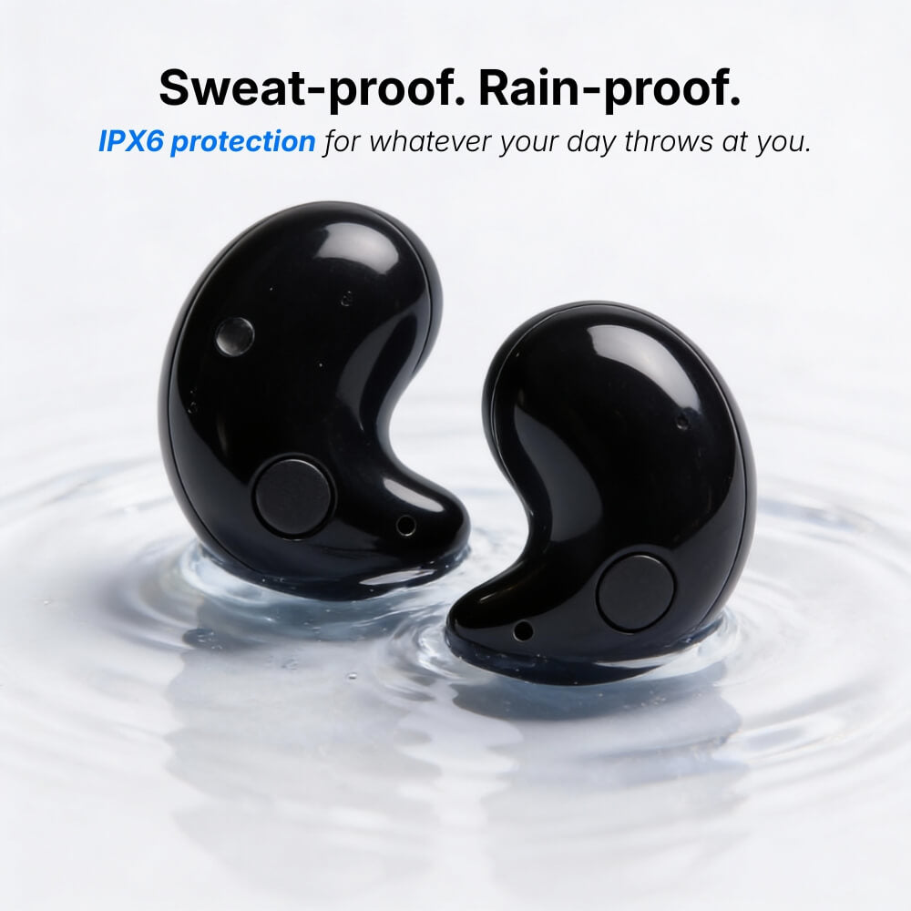 Product photograph of two sleek black wireless IPX6 waterproof earbuds partially submerged in clear rippling water highlighting their sweat-proof and rain-proof features