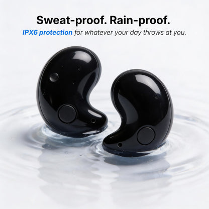 Product photograph of two sleek black wireless IPX6 waterproof earbuds partially submerged in clear rippling water highlighting their sweat-proof and rain-proof features